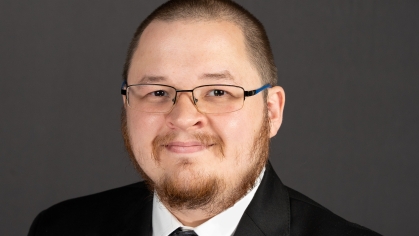 male in black suit