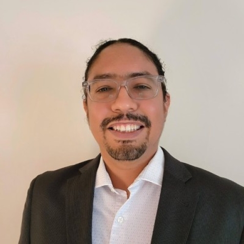 male with glasses and black jacket