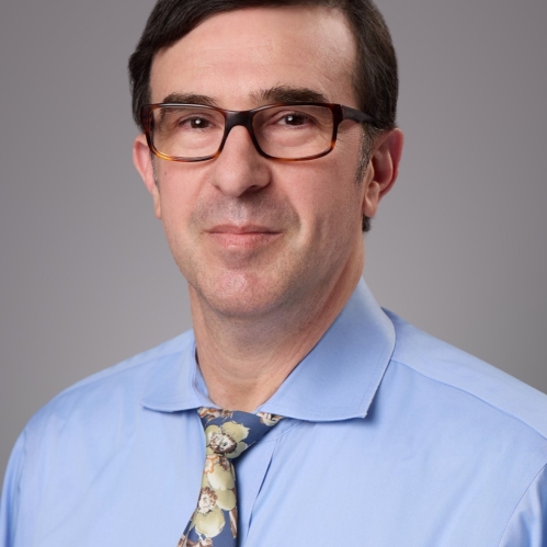 male with glasses and blue dress shirt