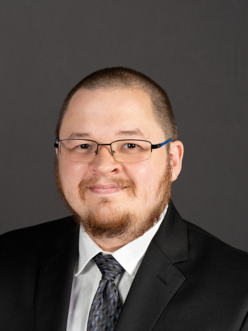 male in black suit