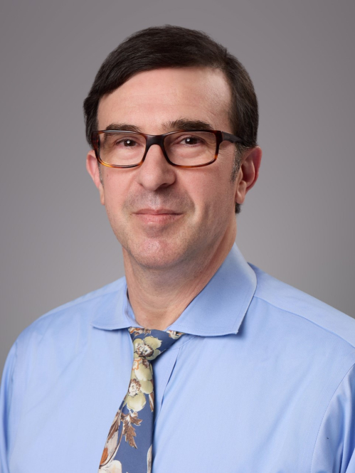 male with glasses and blue dress shirt