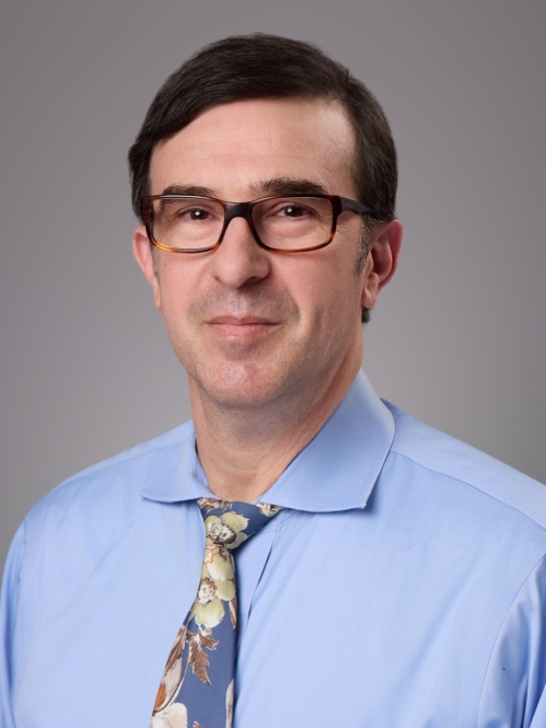 male with glasses and blue dress shirt