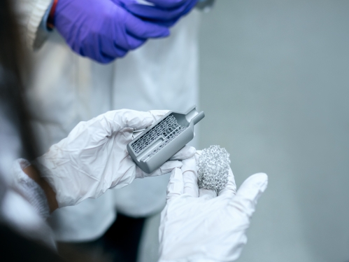 Chemical engineer showing materials to colleague