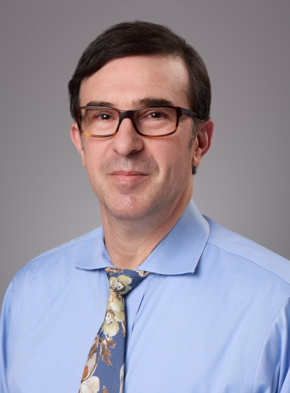 male with glasses and blue dress shirt