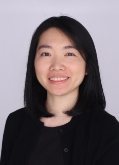 headshot of smiling female with shoulder length brown hair